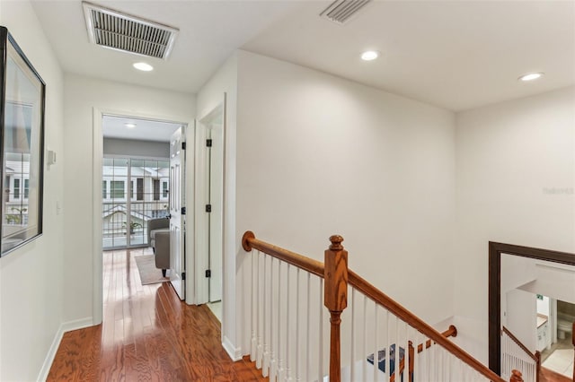 hallway with wood-type flooring