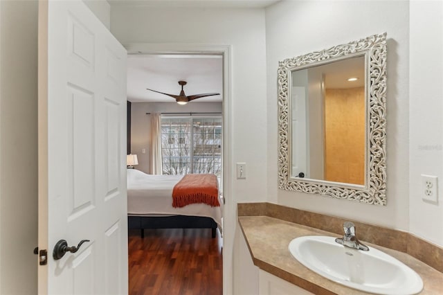 bathroom featuring ceiling fan, vanity, and hardwood / wood-style flooring