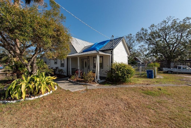 exterior space with a front yard and a porch