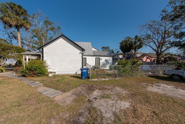 view of home's exterior with a lawn