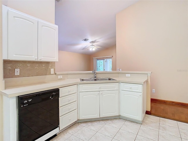 kitchen featuring sink, white cabinets, black dishwasher, light tile patterned flooring, and kitchen peninsula