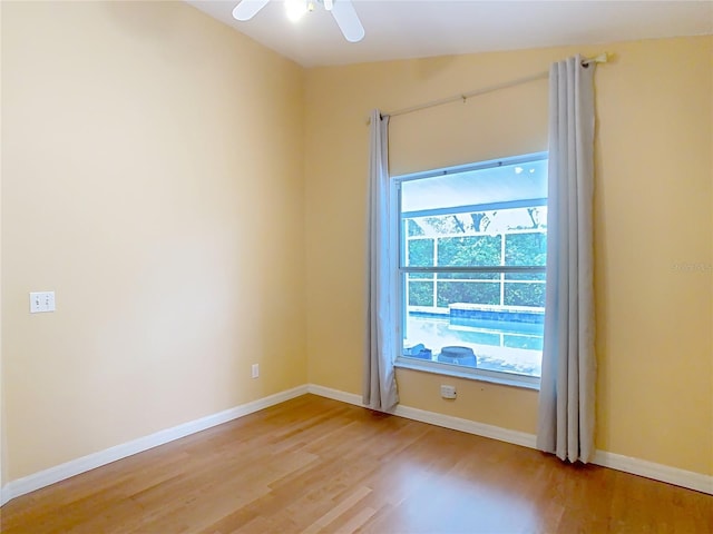 spare room with ceiling fan and light hardwood / wood-style floors