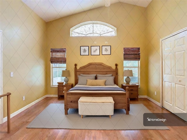 bedroom with lofted ceiling