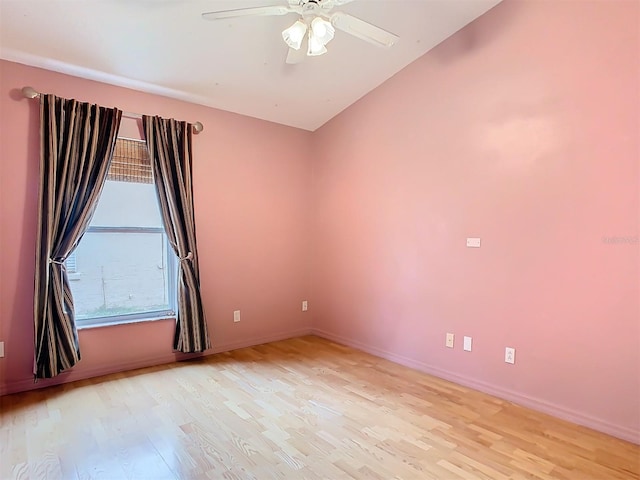 empty room with ceiling fan and light hardwood / wood-style floors