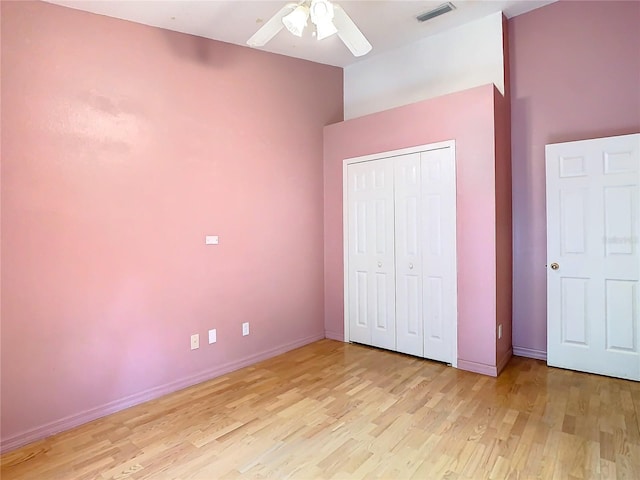 unfurnished bedroom with a closet, ceiling fan, and light hardwood / wood-style floors