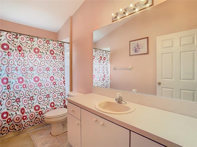 bathroom with vanity, tile patterned floors, and toilet