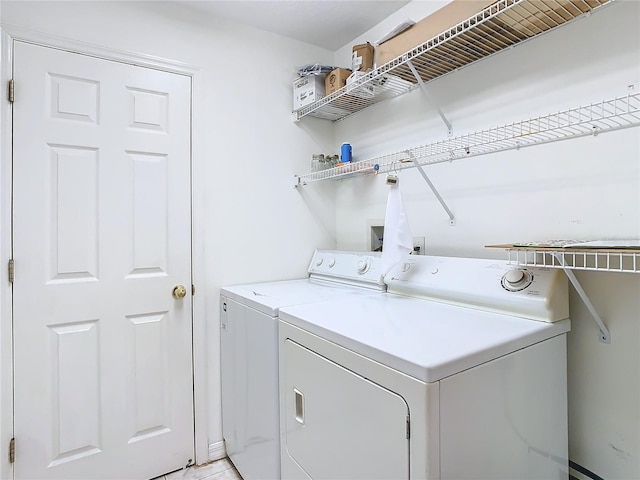 laundry room with washer and clothes dryer