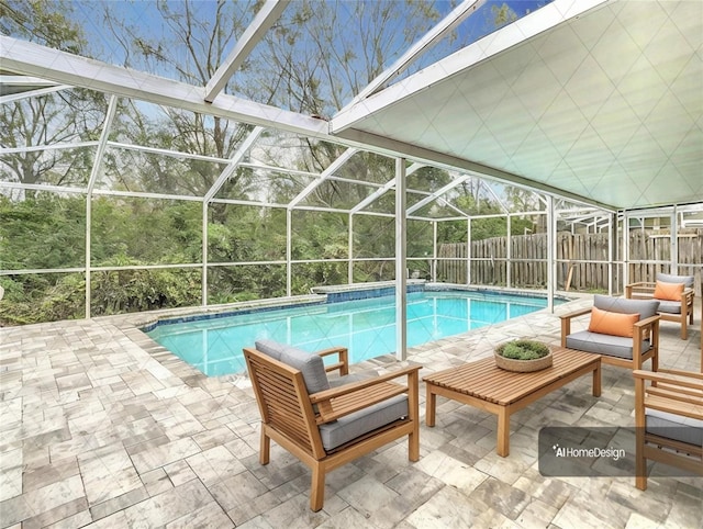 view of pool with a lanai, a patio area, and outdoor lounge area