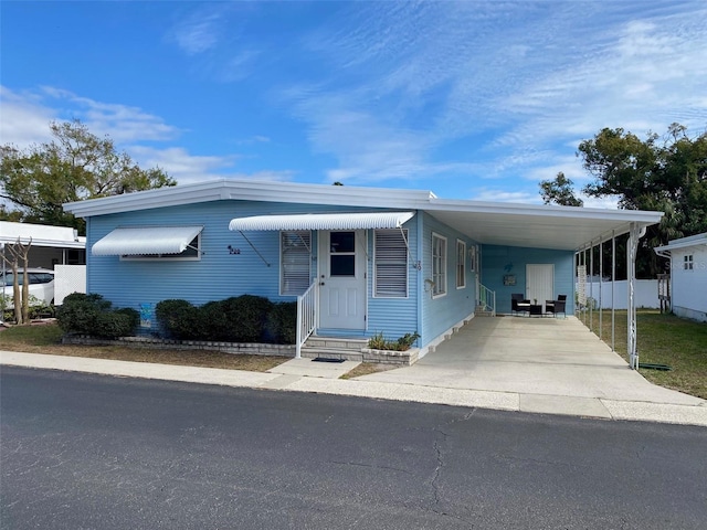 manufactured / mobile home featuring a carport