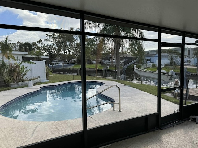 view of swimming pool with a water view