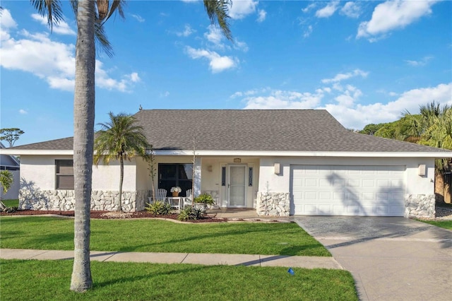 ranch-style house featuring a garage and a front yard