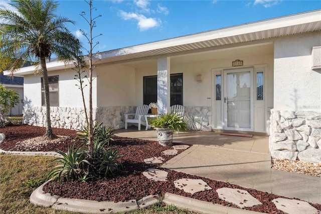 entrance to property featuring a porch