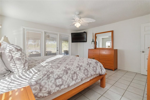 bedroom featuring access to outside, ceiling fan, and light tile patterned floors