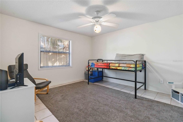 tiled bedroom with ceiling fan