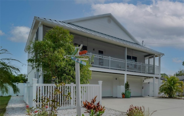 view of front facade with a balcony and a garage