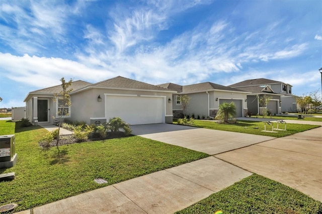 ranch-style home featuring a garage and a front lawn