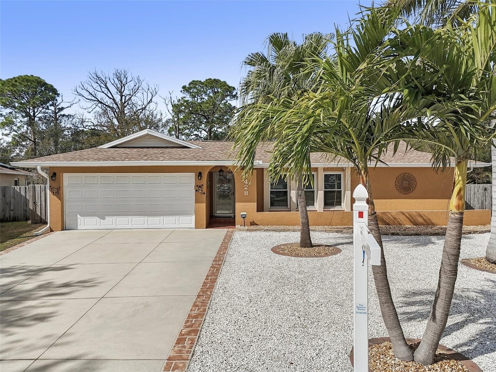 single story home featuring a garage