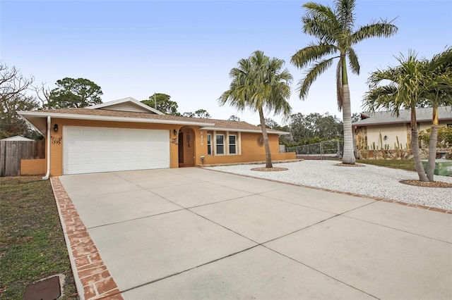 ranch-style home featuring a garage