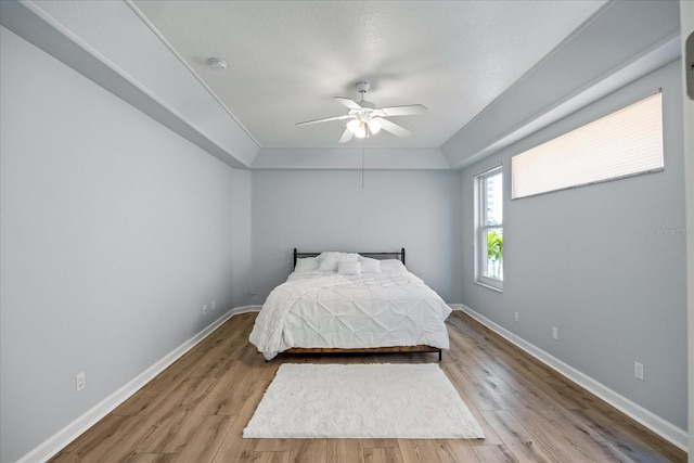 bedroom featuring ceiling fan and light wood-type flooring