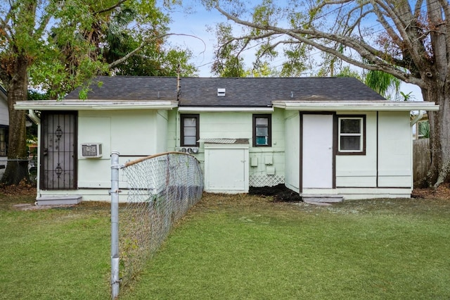 back of house with a yard