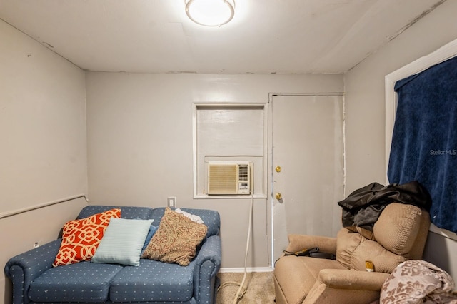 sitting room with cooling unit and carpet