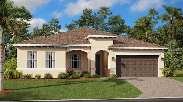 mediterranean / spanish-style house featuring a front yard and a garage