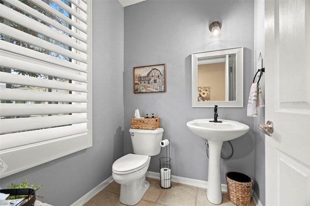 bathroom with sink, tile patterned flooring, and toilet