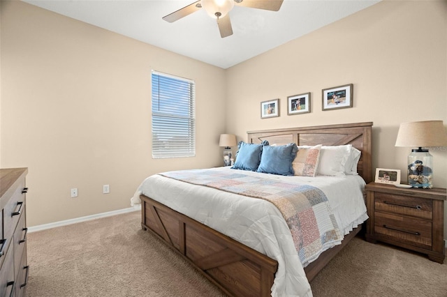 bedroom featuring ceiling fan and light carpet