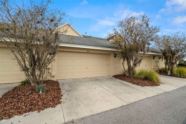 ranch-style home with a garage