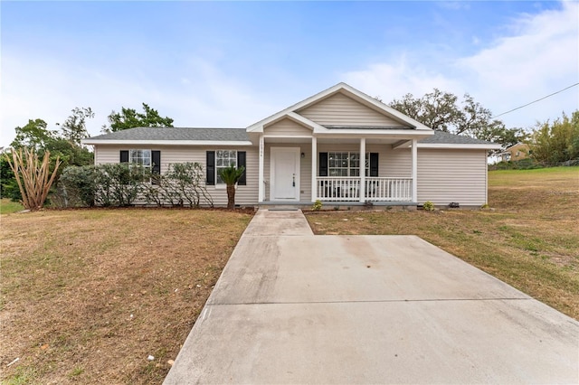 view of front of home with a front yard and covered porch