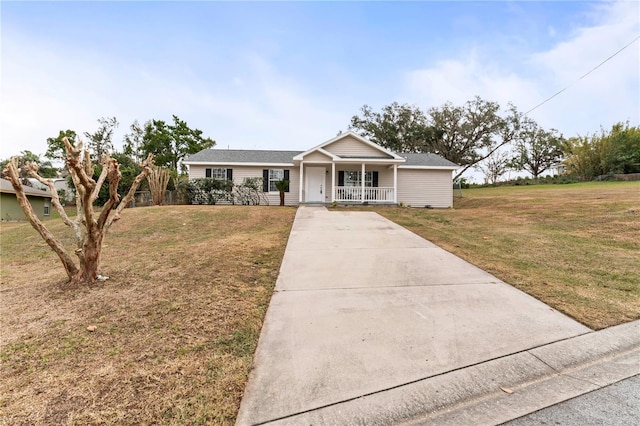 single story home with a front yard and covered porch