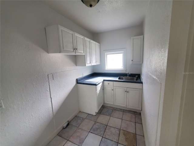 kitchen with white cabinets and sink