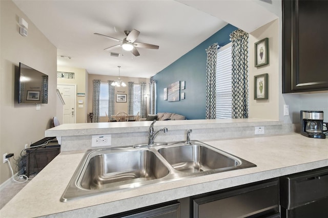 kitchen with pendant lighting, sink, a wealth of natural light, and dishwasher