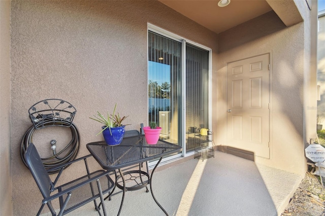 doorway to property with a patio