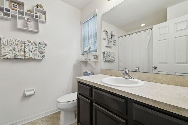 bathroom featuring vanity, a shower with shower curtain, tile patterned floors, and toilet