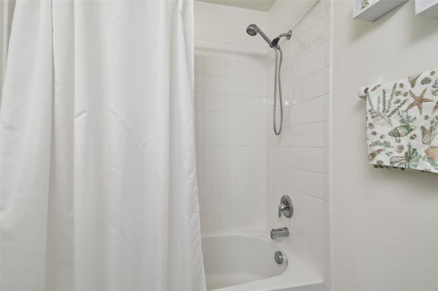 bathroom with shower / bath combination with curtain