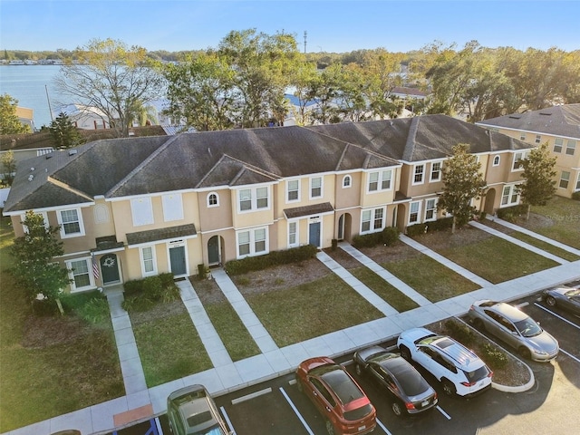 birds eye view of property featuring a water view