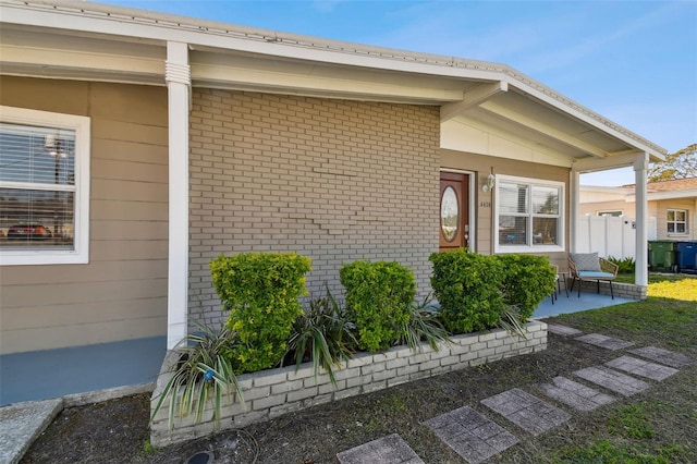 doorway to property featuring a patio area