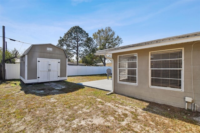 view of yard with a patio area and a storage shed