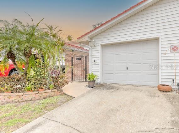 view of front of property with a garage and an outdoor structure