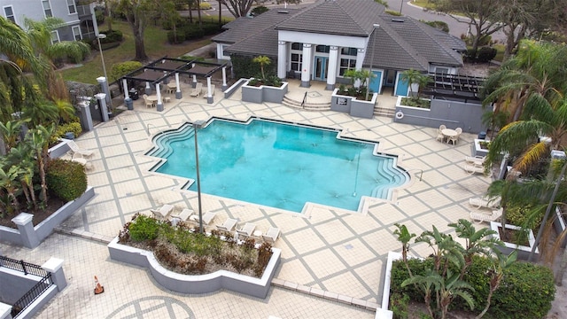 view of pool with a patio area and a pergola