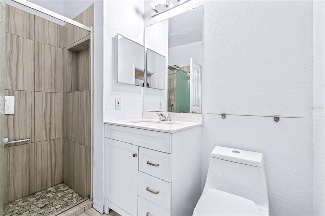 bathroom with toilet, walk in shower, and vanity