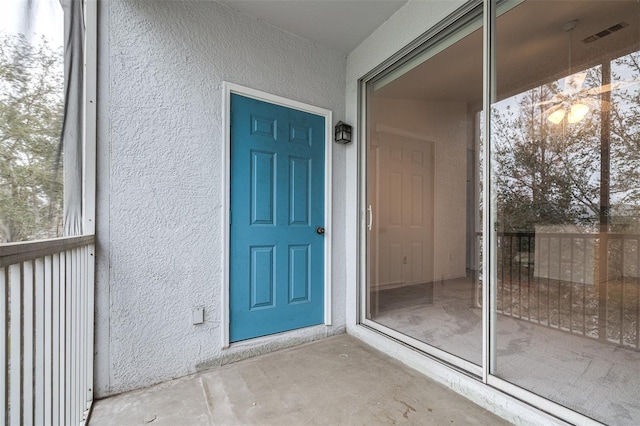 property entrance with a balcony