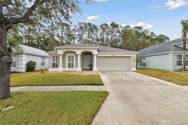 ranch-style house with a garage and a front yard