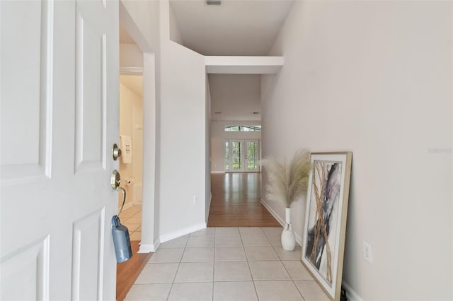 hallway with light tile patterned flooring