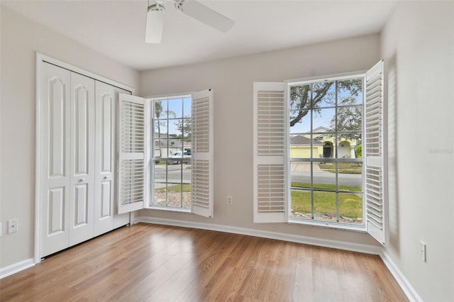 interior space with ceiling fan and light hardwood / wood-style flooring