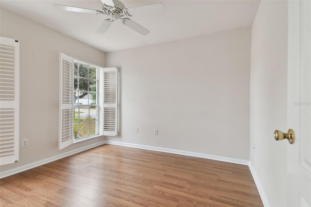 empty room featuring ceiling fan and light hardwood / wood-style flooring