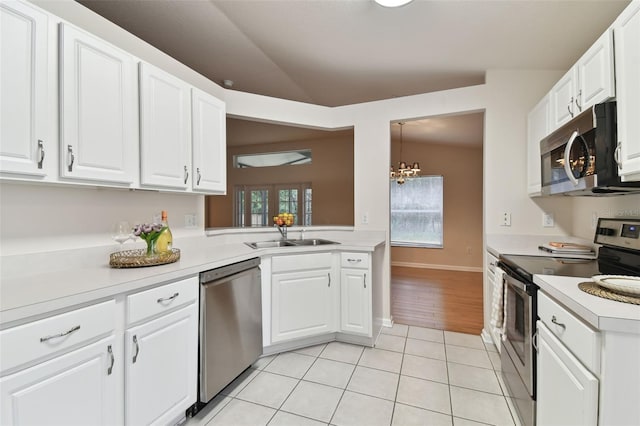 kitchen featuring white cabinetry, appliances with stainless steel finishes, sink, and light tile patterned floors