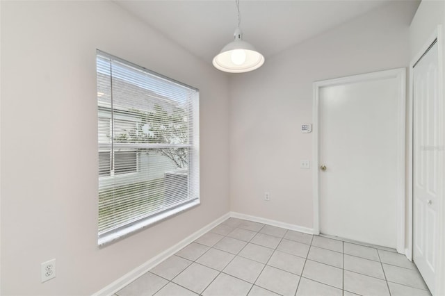 unfurnished dining area with light tile patterned floors