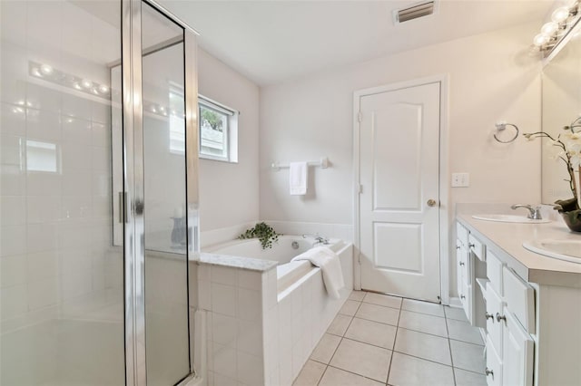 bathroom with vanity, separate shower and tub, and tile patterned flooring